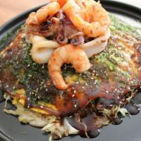 Deluxe Seafood-H · Layered  vegetables on the top of crepes  like batter with  bonito flakes, pork belly, stir ...