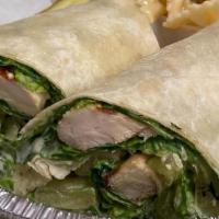 Grilled Chicken Caesar Wrap · Served with pickles and pasta salad.