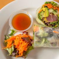 Tuna Steak Roll · Grilled tuna, avocado, carrot, cucumber and mixed greens. Rolled in rice paper and served wi...