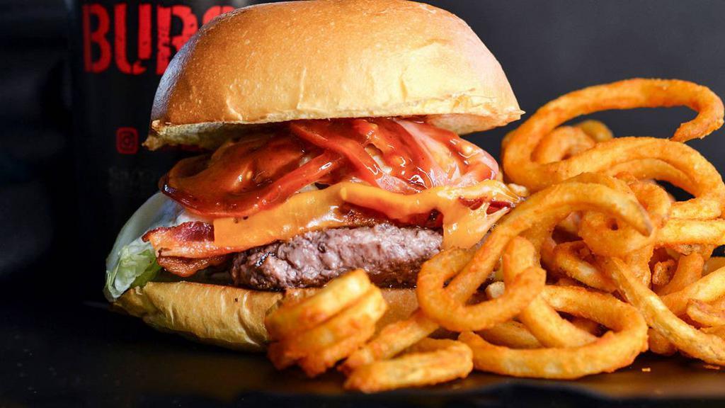 Bacon Black Burger · Served with cheese, lettuce, tomato, pickles, onions, and house sauce. *if you combo it, please specify your choice of soda in special instructions.