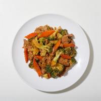 Beef And Broccoli · Beef sautéed with broccoli, white onions, and carrots in a light garlic sauce.