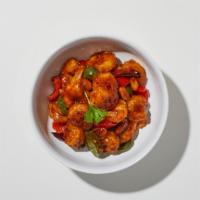 Kung Pao Shrimp · Shrimp sautéed with chili pepper, zucchini, white onions, carrots, and roasted peanuts in ch...