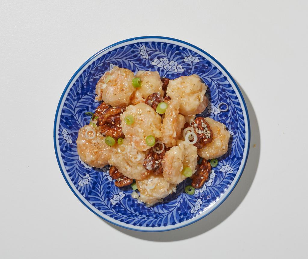 Honey Walnut Shrimp · Shrimp with a light egg batter, sautéed with special white cream sauce with glazed walnuts and broccoli.