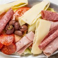 Antipasto · Lettuce, tomatoes, green olives, black olives, cucumbers, ham, salami, and provolone cheese.