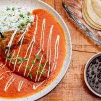 Chile Relleno De Queso · Poblano pepper stuffed with our blend of melted cheese, tomato mild chipotle sauce, and rice...