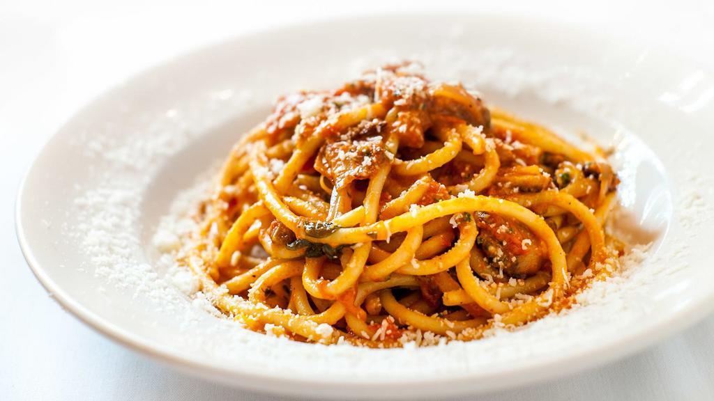 Buccatini All’ Amatriciana · With homemade guanciale, tomato, pecorino romano.