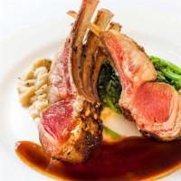 Rack Of Lamb · With cannellini beans, broccoli rabe, and rosemary jus.