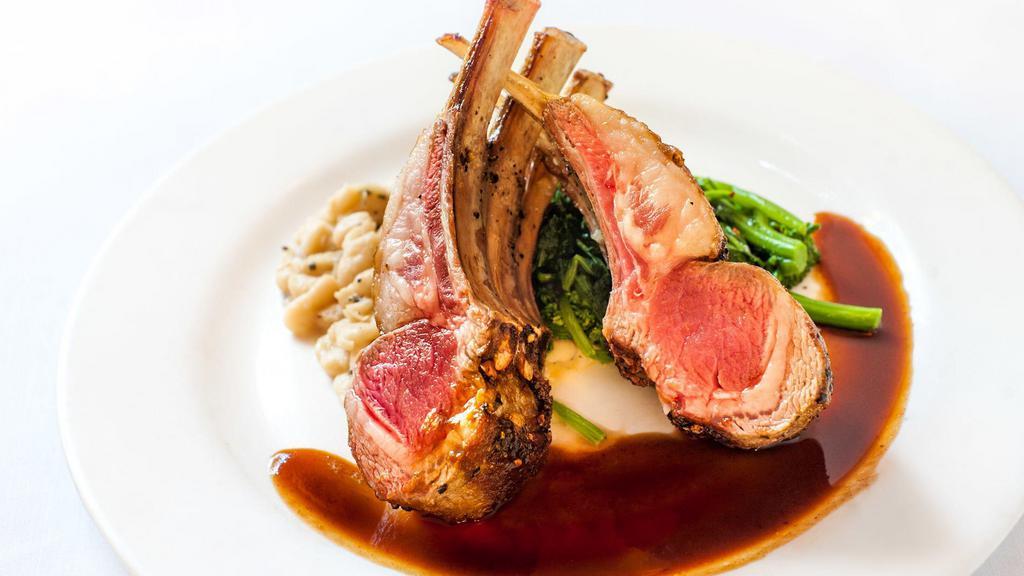 Rack Of Lamb · With cannellini beans, broccoli rabe, and rosemary jus.