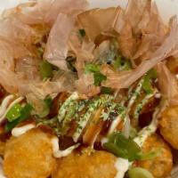 Tots · Okonomiyaki style.  Mayo, Oko sauce, scallion, nori powder and bonito (fish) flakes