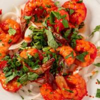 Shrimp Tandoori · Mild, large, mouth-watering shrimp lightly seasoned and slowly broiled over charcoal in the ...
