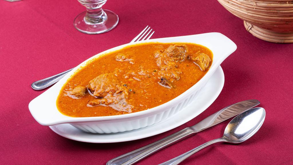 Lamb Pasanda · Slices of lamb marinated in cream and cooked with chopped tomatoes in creamy sauce.