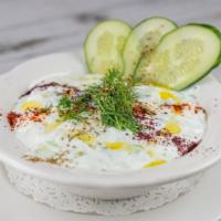 Cacik · Chopped cucumber blended with garlic, mint, dill and yogurt.