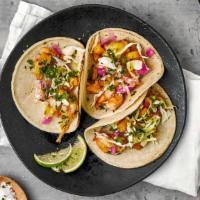 Salt & Pepper Shrimp Taco · Create your Ajo Shrimp taco with simply seasoned shrimp, your choice of Tributo toppings and...