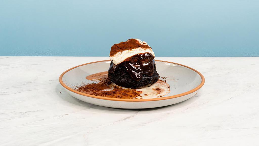 Chocolatey Uno Mas Leche Cake · Our tres leches needed one more milk! Enjoy this EVOO devil's food cake, soaked to fudgy perfection. This decadent cake is topped with a smooth honey-chocolate glaze, a dollop of whipped creme fraiche and chocolate shavings | Allergen: Gluten, Milk, Egg