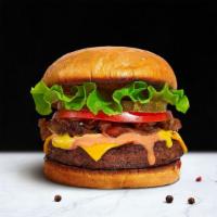 The Basic Burger · American beef patty topped with buttered lettuce, tomato, onion, and pickles. Served on a wa...