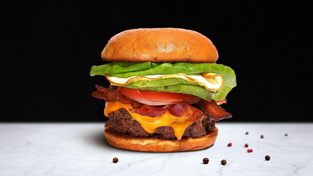Good Morning Burger · American beef patty cooked medium rare and topped with bacon, fried egg, avocado, melted cheese, buttered lettuce, tomato, onion, and pickles. Served on a warm bun.