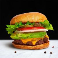 . Guac'S Burger · American beef patty cooked medium and topped with avocado, melted cheese, buttered lettuce, ...