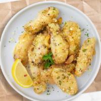 The Great Garlic Parmesan Wings · Fresh chicken wings breaded, fried until golden brown, and tossed in garlic and parmesan. Se...