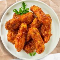 Habanero Hero Wings · Fresh chicken wings breaded, fried until golden brown, and tossed in mango habanero sauce. S...