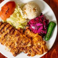 Chicken Chops · Chicken chops, char grilled served with rice and vegetables.