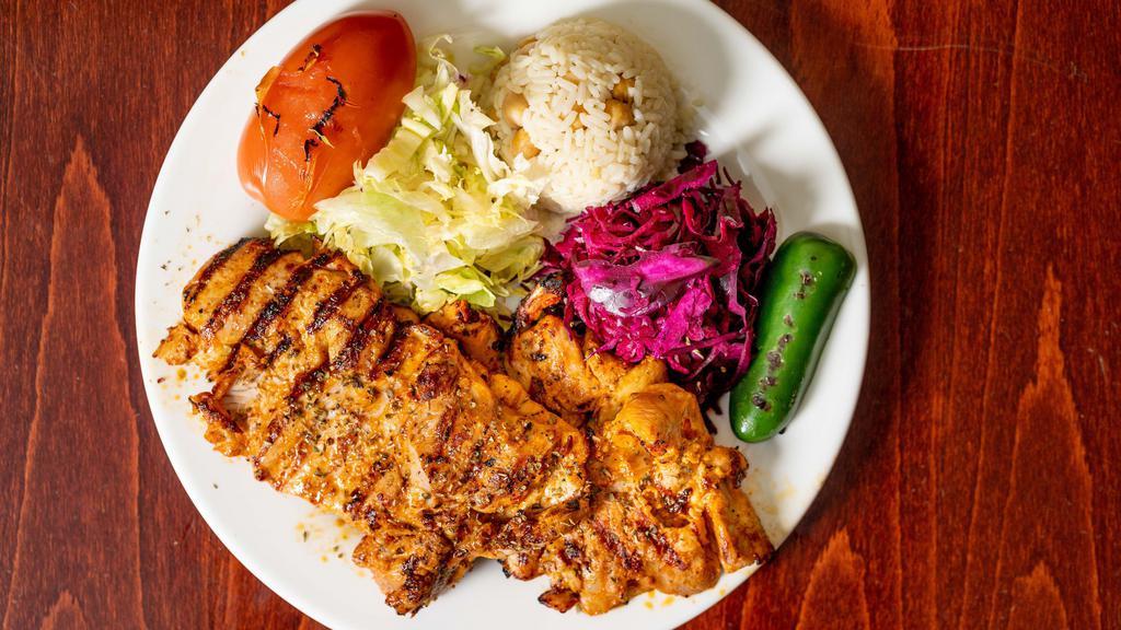 Chicken Chops · Chicken chops, char grilled served with rice and vegetables.