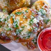 Garlic Knots · Six large fluffy garlic knots rolled and topped with garlic and parsley, finished with parm ...
