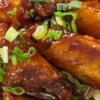 Sweet Bbq Wings · 6pc sweet BBQ wings with scallions and a side of ranch or blue cheese dressing.