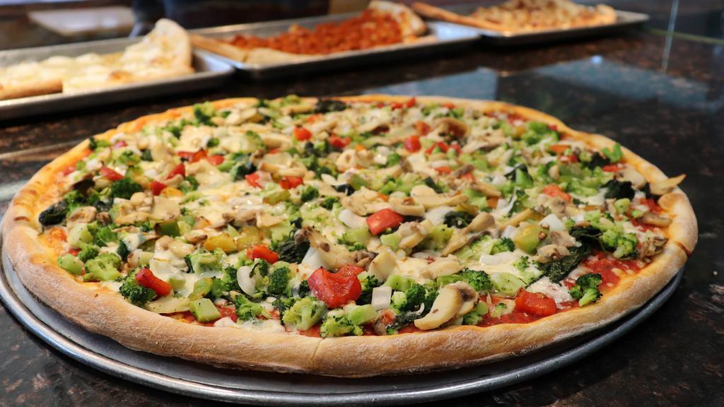 Supreme Veggie Pizza · Red and green peppers, mushrooms, broccoli, olives, tomatoes, and onions with tomato sauce and mozzarella cheese.