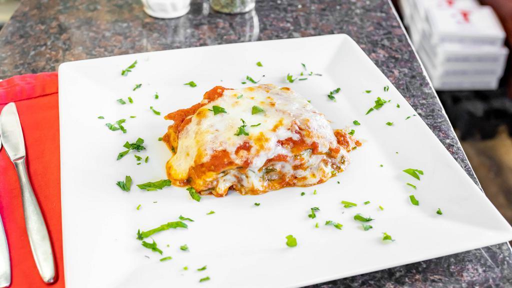 Lasagna · Our grandmother's classic lasagna with beef bolognese sauce, mozzarella, and ricotta cheese.