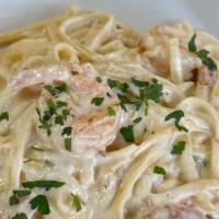 Fettuccine Alfredo With Shrimp · Fettuccine pasta in a classic white alfredo sauce with jumbo shrimp.