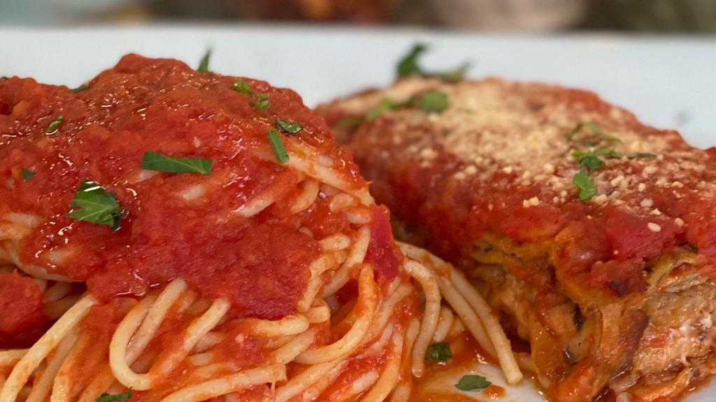 Pasta With Eggplant Parmigiana · Breaded baked eggplant with your choice of pasta in tomato sauce topped with mozzarella cheese.