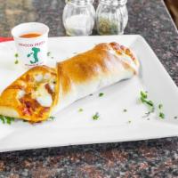 Chicken Roll · Breaded chicken baked in a roll with tomato sauce and mozzarella cheese.