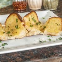 Garlic Bread · Baked bread with butter and garlic oil.
