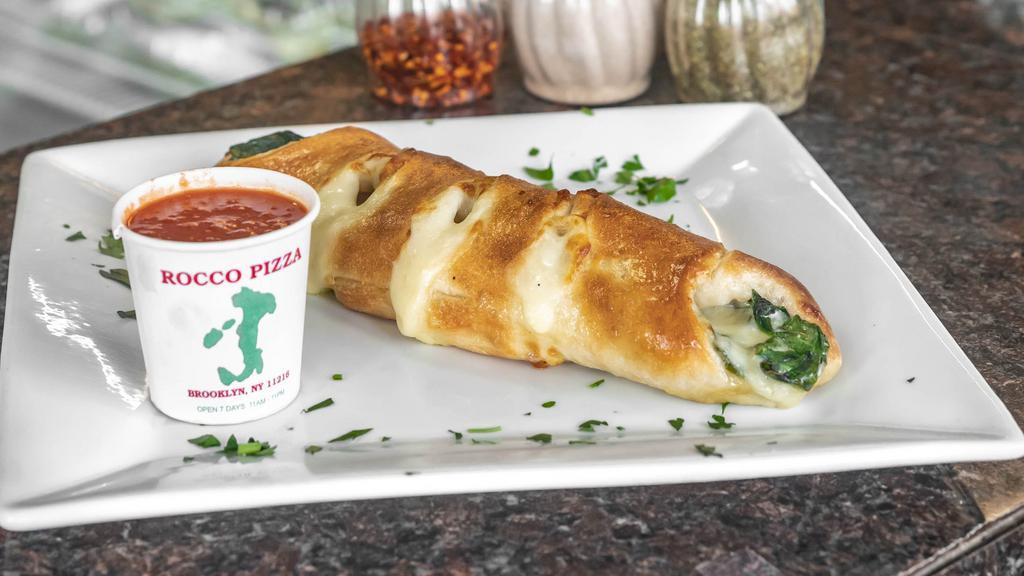 Spinach Roll · Baked spinach roll with ricotta and mozzarella cheeses.