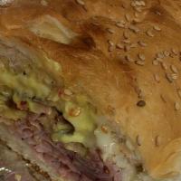 The Boss Hog · Virginia baked ham topped with melted mozzarella and American on a toasted roll with spicy p...