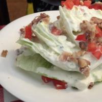 Classic Iceberg Wedge Salad · house-made chunky blue cheese dressing, tomatoes, red onion, and bacon crumble