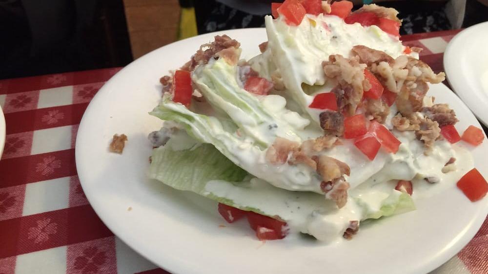 Classic Iceberg Wedge Salad · house-made chunky blue cheese dressing, tomatoes, red onion, and bacon crumble