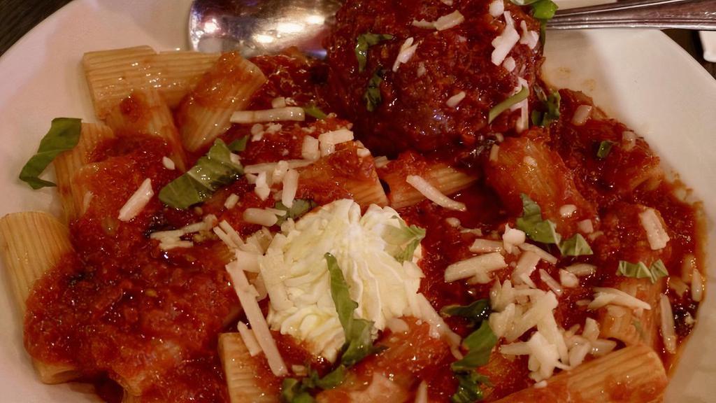 Rigatoni & Meatball · 4 oz meatball (Beef + Pork) with a dollop of ricotta cheese served over Rigatoni noodles