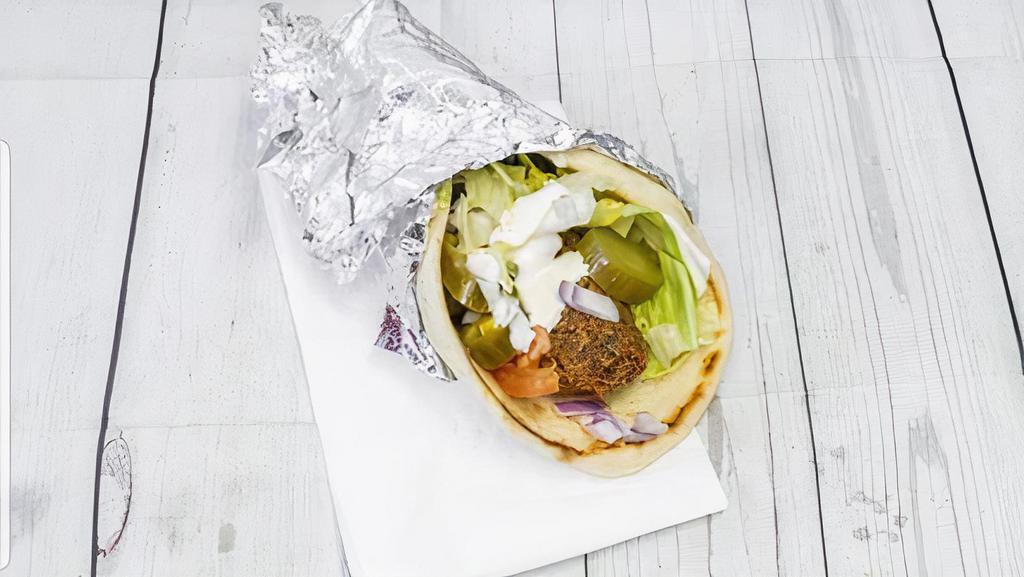 Falafel Sandwich · Comes with lettuce tomatoes & please tell us if you want white sauce and hot sauce on it - please specify if you would like something removed/substituted.