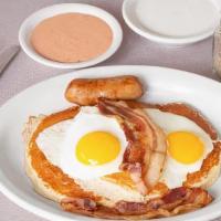 1234 The Hungry Man · Two pancakes, two eggs, one ham, one sausage, and, two bacon strips.