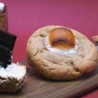 Chocolate Hazelnut S'Mores Cookie · 5 oz Brown sugar cookie stuffed with chocolate hazelnut spread and topped with roasted marsh...