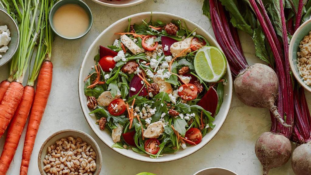 Make It Grain · Honey ginger vinaigrette, organic arugula, farro, quinoa, grapes, beets, carrots, feta, fresh lime, and candied pecans. Recommended with roasted chicken.