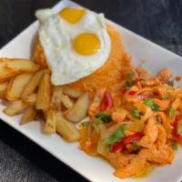 Pollo Salteado · GLUTEN FREE.Chicken strips sauteed with onions, red peppers, and cilantro. Yellow Rice, Home...