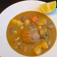 Caldo De Bola · Beef soup with green plantain, yucca, corn and carrots. Green plantain dumpling filled with ...