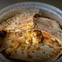 Buenos Días Quesadillas · Eggs, green or red peppers, onions, turkey bacon crumbles, low-fat Cheddar cheese with a sid...