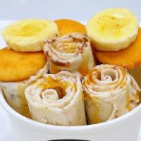Monkey Business · Base: Sweet Cream. Mix-in: Banana. Toppings: Nilla Wafer, Banana.