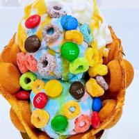 Rainbow · Waffle with 2 scoops of cottoncandy ice cream. Topped with frootloops and M&M.