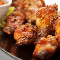 Tandoori Wings · Marinated chicken wings cooked in our exclusive clay oven.