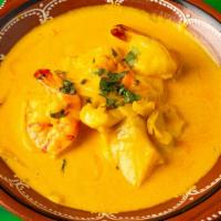 Moqueca De Peixe · Fish and shrimp stew in palm oil and coconut milk, rice, fish flour gravy.