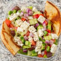Greek Salad · Romaine lettuce, tomatoes, onion, peppers, olives, cucumbers, feta, grape leaves.